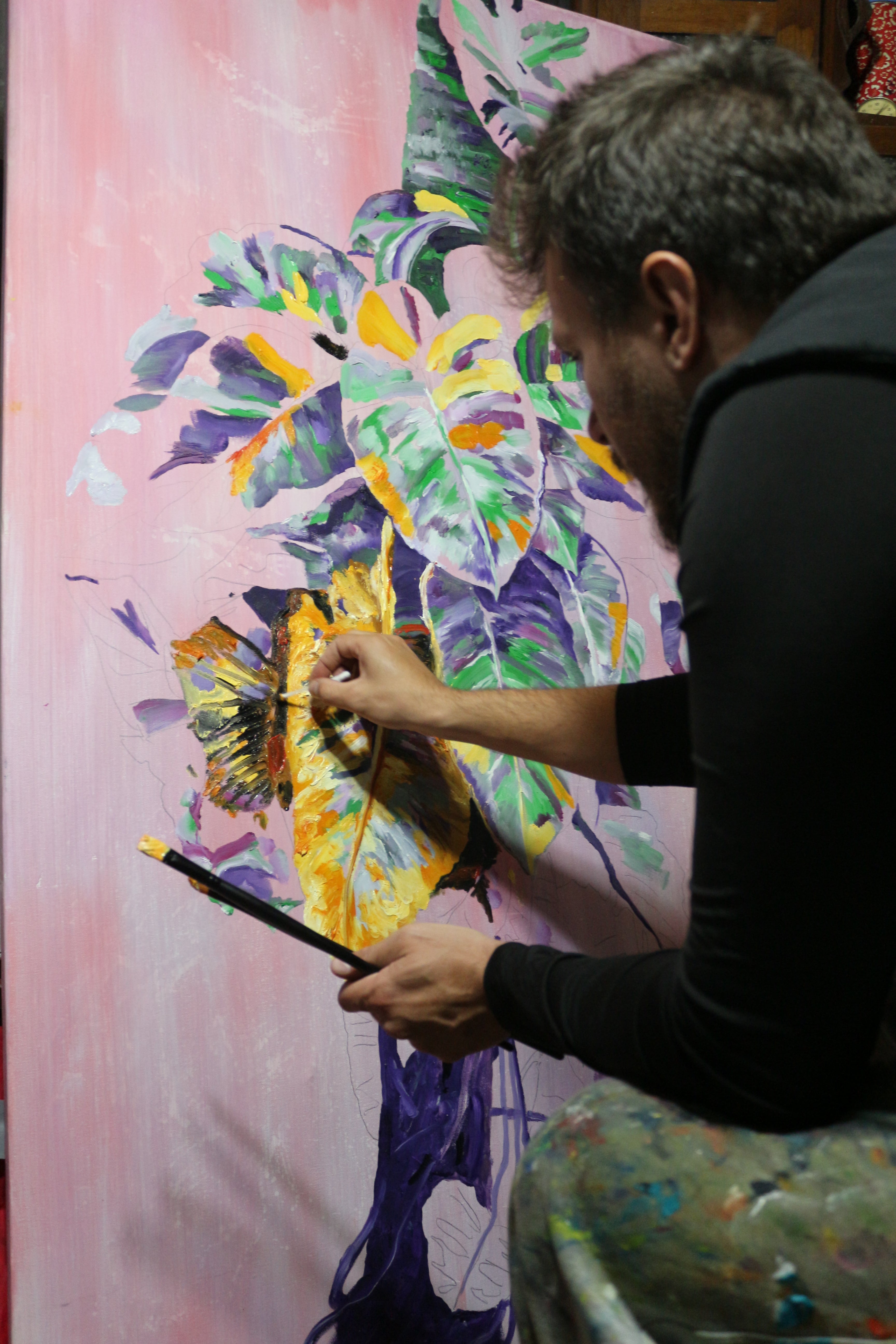 Dominic Virtosu painting the artwork "Jungle" in the winter between 2018 and 2019 in his country-side studio in Romania.